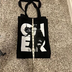 Cher butane, lighter keychain, and canvas bag all new